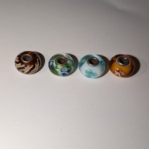 Four glass trollbeads